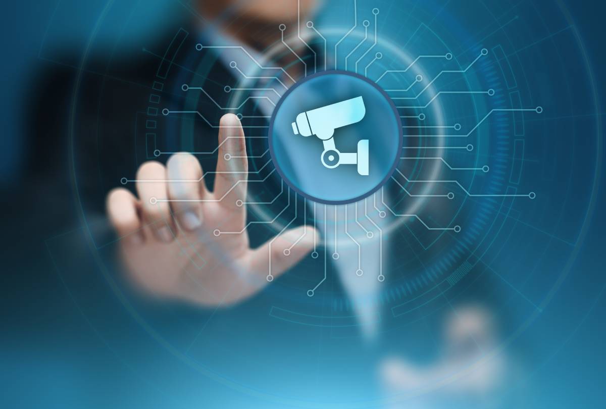 Man holding digital video surveillance icon